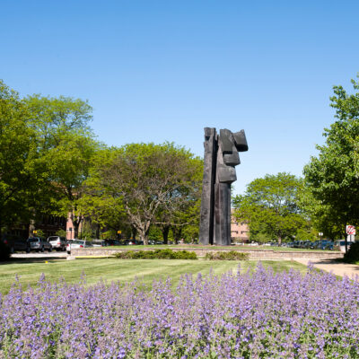 grass lawn with tall sculpture