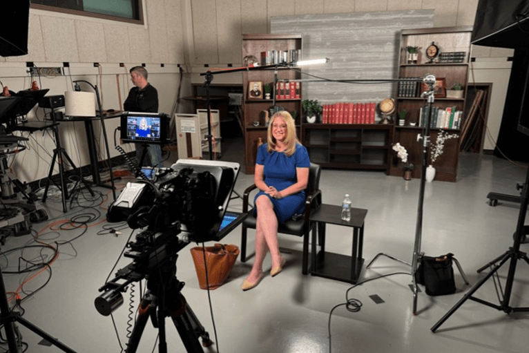 A woman being interviewed in the Purdue Brand Studio Productions studio.